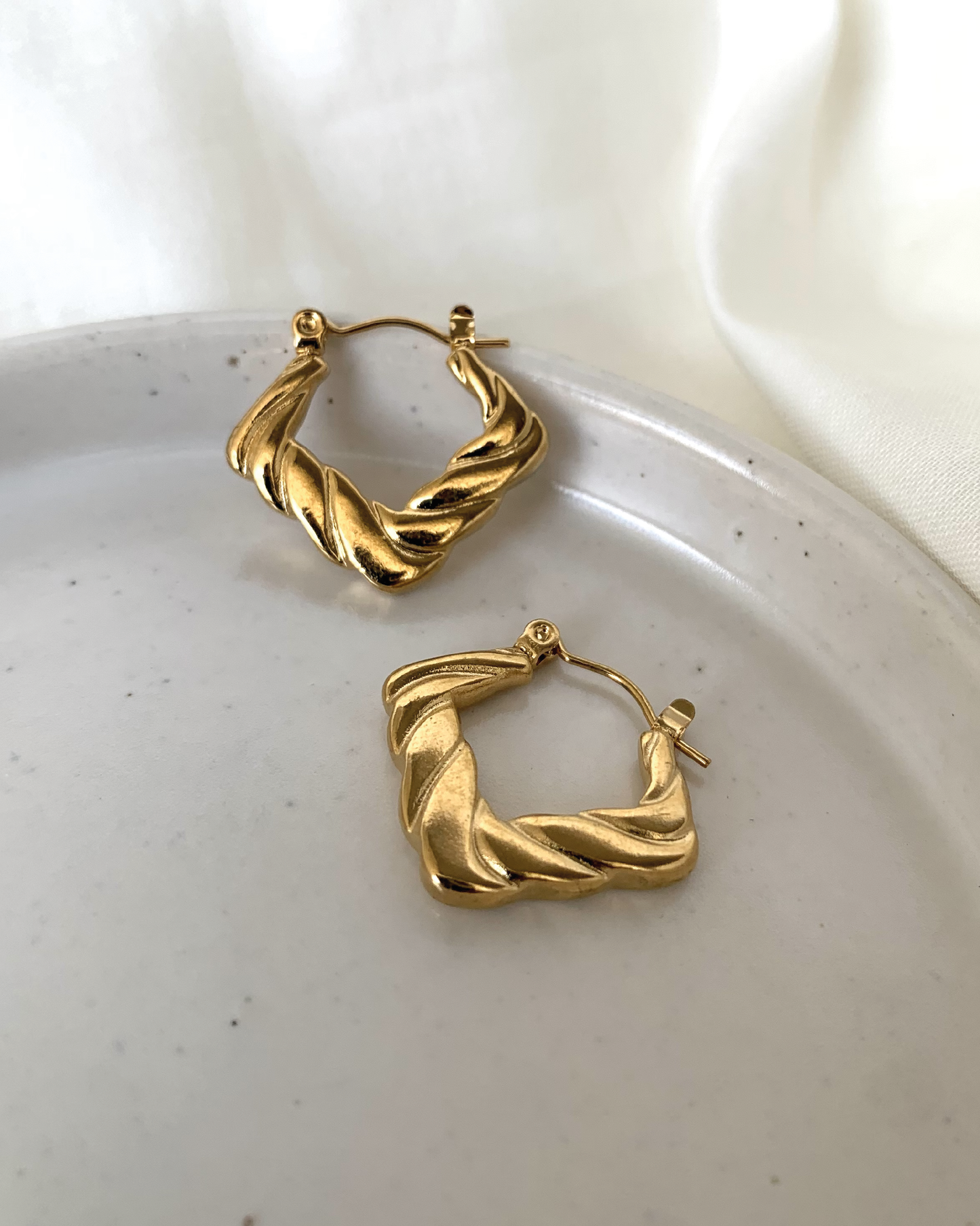 Edgy Artistry Hoop Earrings